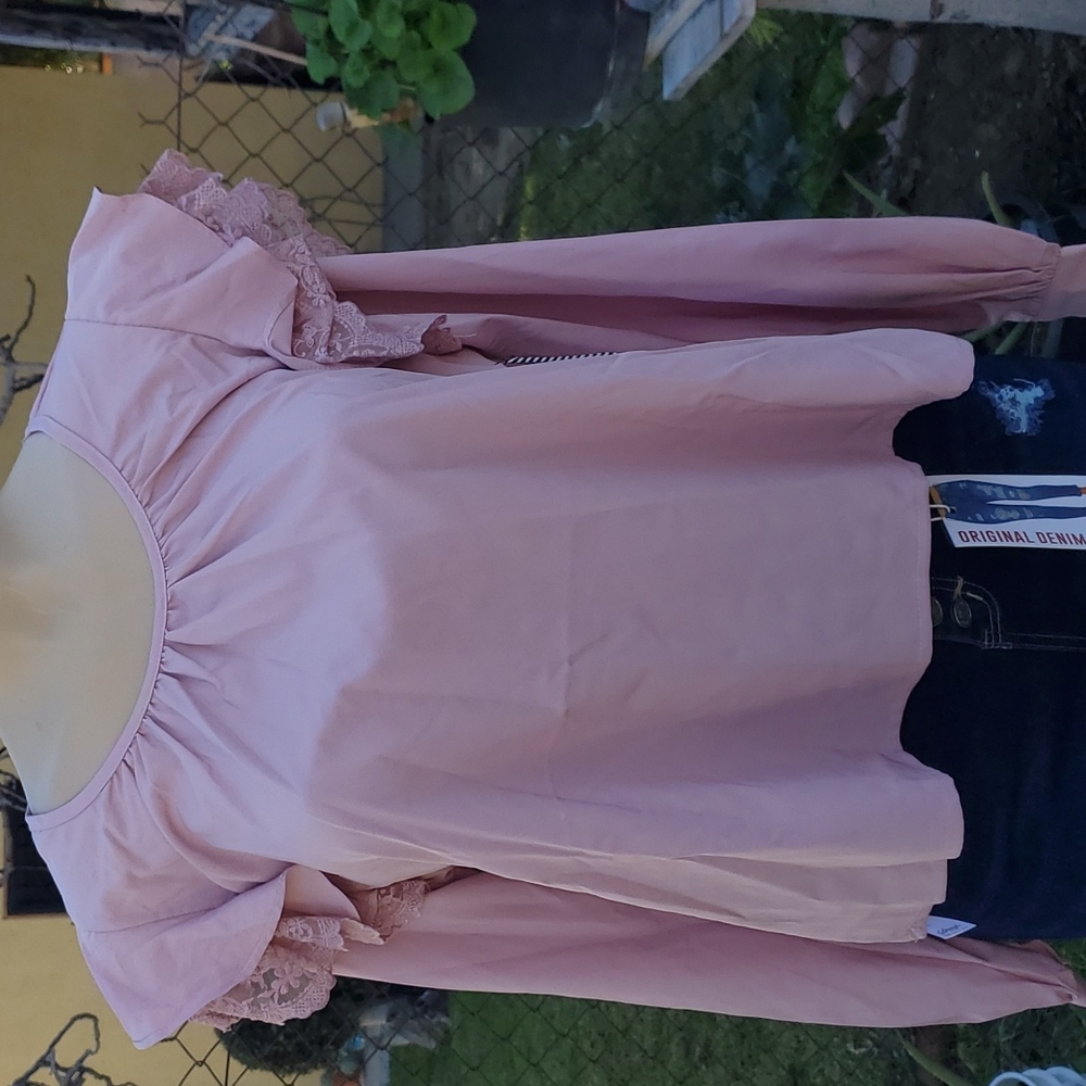 Pink long sleeve with ruffles on the shoulder
